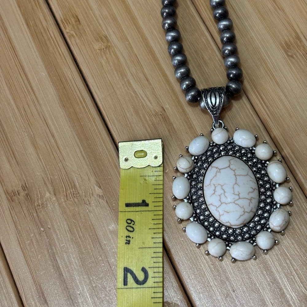 White faux turquoise and silver tone jewelry set.
NWOT. - Picture 7 of 9